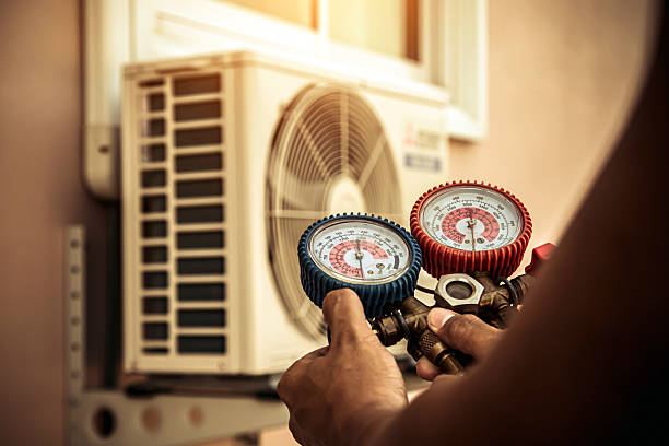 Professional Air Conditioning Service technician working in North Carver, MA